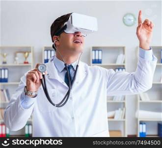Young doctor with vr virtual reality headset working in the office. Young doctor with vr virtual reality headset working in the offi