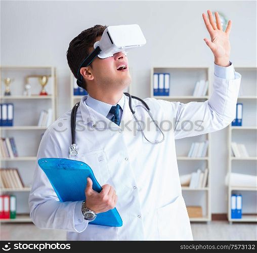 Young doctor with vr virtual reality headset working in the office. Young doctor with vr virtual reality headset working in the offi