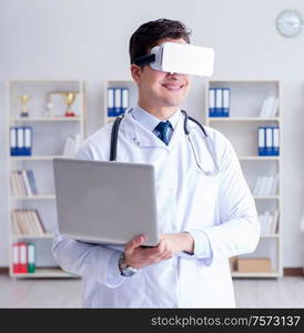 Young doctor with vr virtual reality headset working in the office. Young doctor with vr virtual reality headset working in the offi