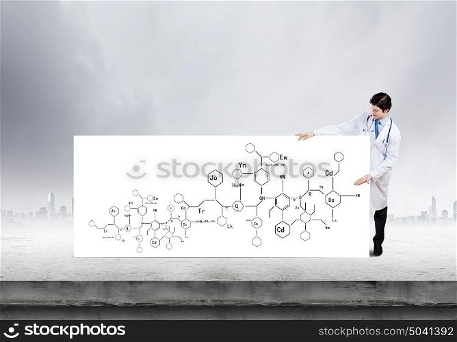 Young doctor with white banner presenting molecule research. Biochemistry report