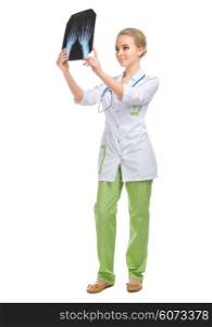 Young doctor with x-ray isolated on white