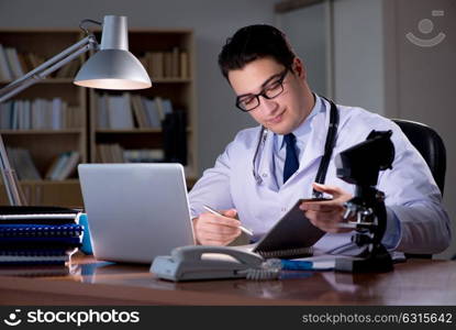 Young doctor working late in the office