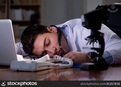 Young doctor working late in the office