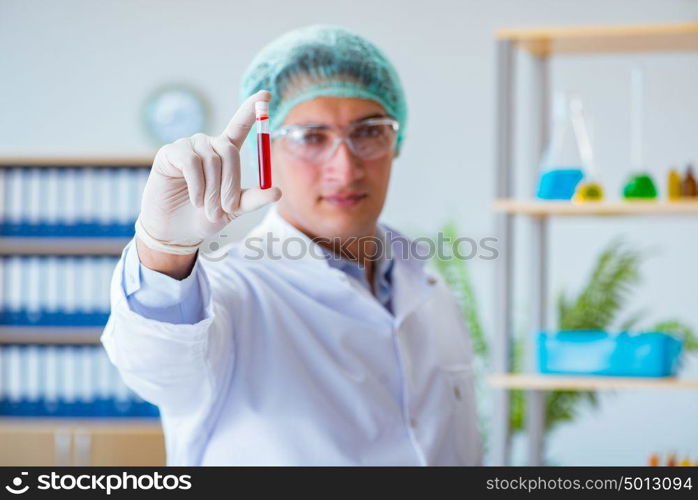 Young doctor working on blood test in lab hospital