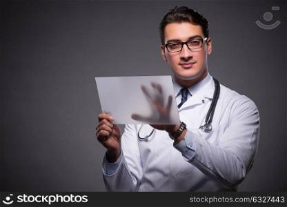Young doctor working on tablet computer