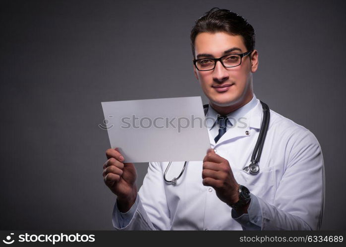 Young doctor working on tablet computer