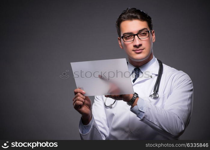 Young doctor working on tablet computer