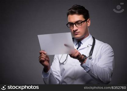 Young doctor working on tablet computer