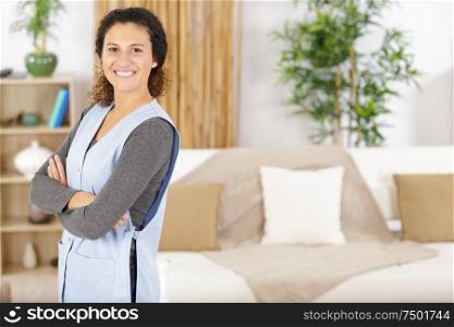 young domestic help in a living room