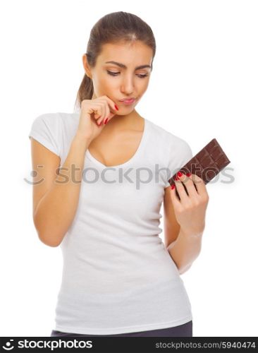 Young doubting girl with chocolate isolated