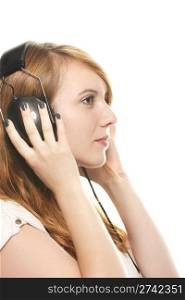 young dreamy redhead woman listening to music with her headphones. young dreamy redhead woman listening to music with her headphones on white background