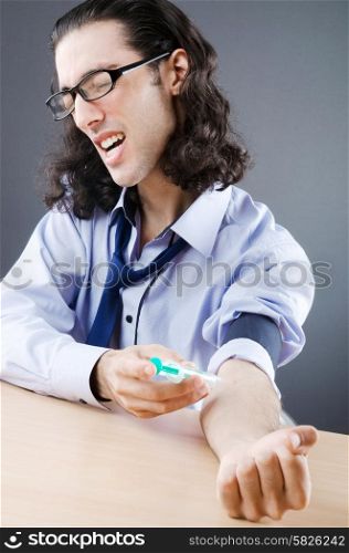 Young druc addict with syringe