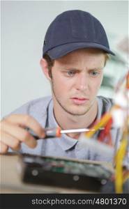Young electrician with puzzled expression