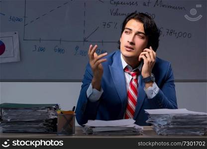 Young elegant financial specialist working in the office night time . Young elegant financial specialist working in the office night t