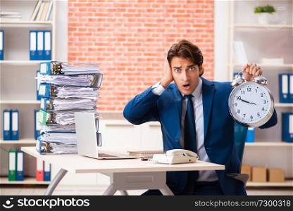 Young elegant man unhappy with too much work 