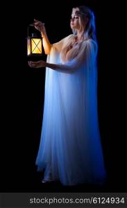 Young elven girl with lantern isolated on black