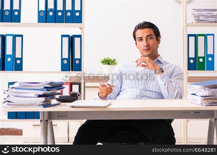 Young employee sitting at the office 