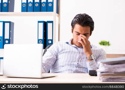 Young employee sitting at the office 