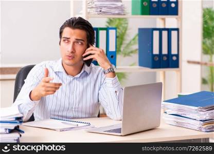 Young employee sitting at the office . The young employee sitting at the office 
