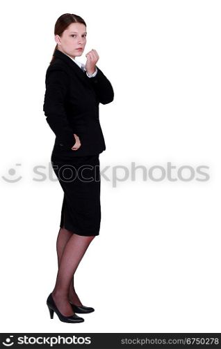 Young employee standing on white background