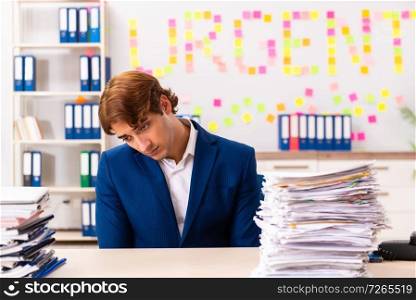 Young employee suffering from excessive work  