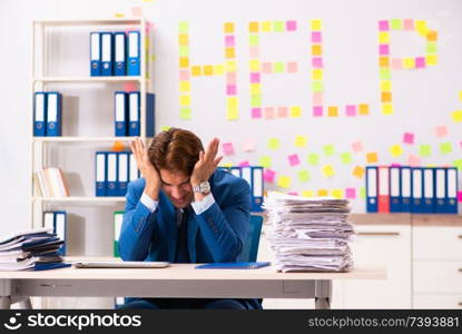 Young employee suffering from excessive work  