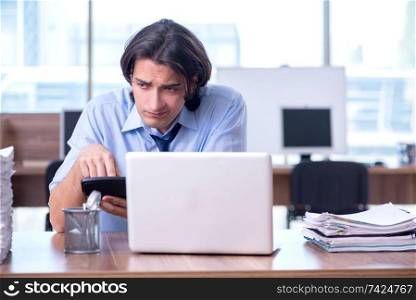 Young employee unhappy with excessive work 