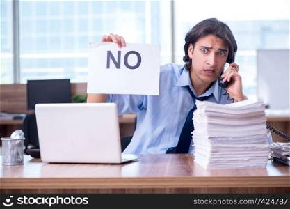 Young employee unhappy with excessive work 