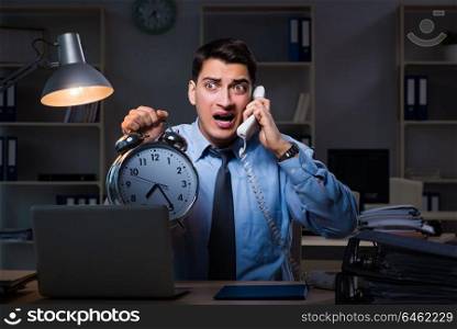 Young employee working overtime to meet deadline