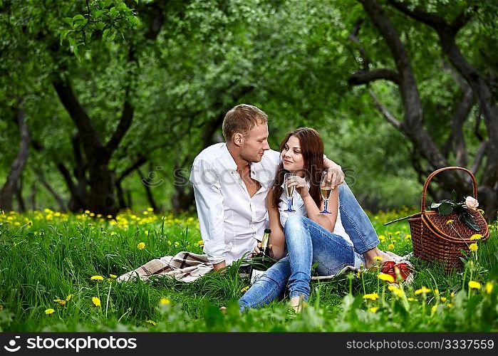 Young enamoured couple on rest in park