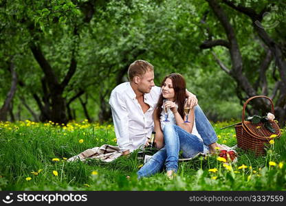 Young enamoured couple on rest in park