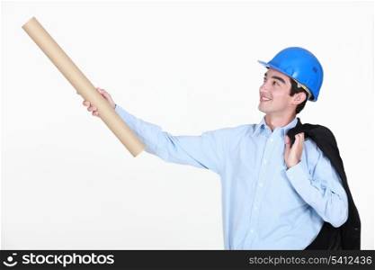 Young engineer holding up a rolled-up drawing
