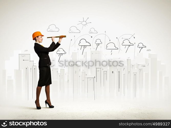 Young engineer. Image of young woman looking into tube. Construction concept