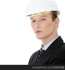 Young engineer in helmet, isolated over white