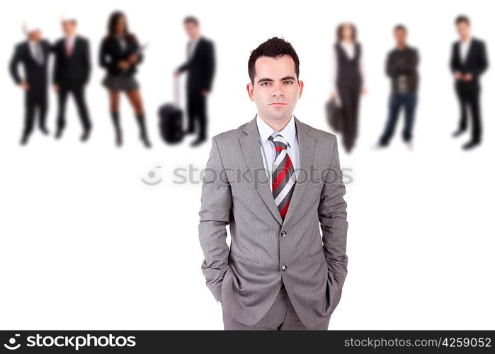 Young engineer posing with some people in the back