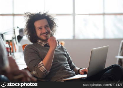 Young Entrepreneur Freelancer Working Using A Laptop And In Coworking space