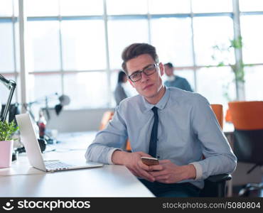 Young Entrepreneur Freelancer Working Using A Laptop In Coworking space