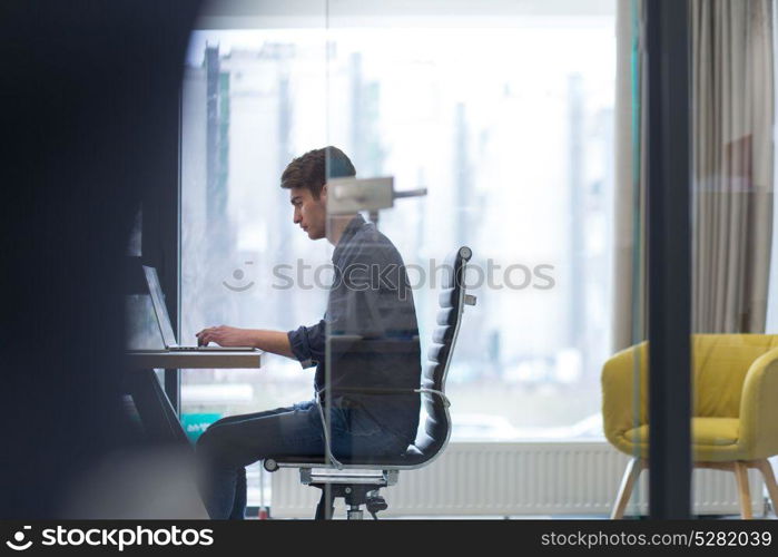 Young Entrepreneur Freelancer Working Using A Laptop In Coworking space