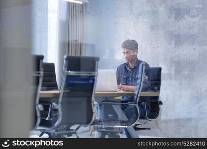 Young Entrepreneur Freelancer Working Using A Laptop In Coworking space