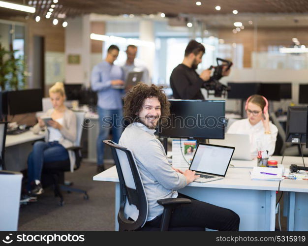 Young Entrepreneur Freelancer Working Using A Laptop In Coworking space