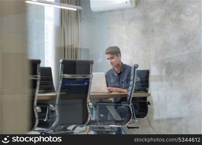 Young Entrepreneur Freelancer Working Using A Laptop In Coworking space