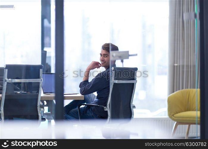 Young Entrepreneur Freelancer Working Using A Laptop In Coworking space