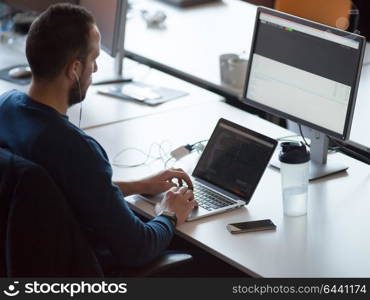 Young Entrepreneur Freelancer Working Using A Laptop In Coworking space