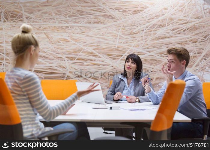 Young entrepreneurs discuss in their modern office