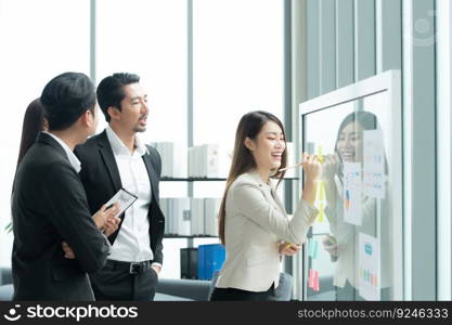 Young entrepreneurs in Asia Organize meetings to brainstorm and review information on glass board to get the best investment conclusion