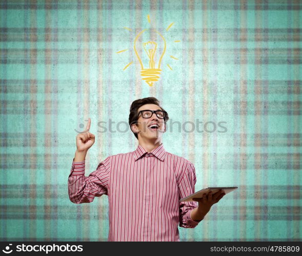 Young erudite. Young man in casual with book in hands