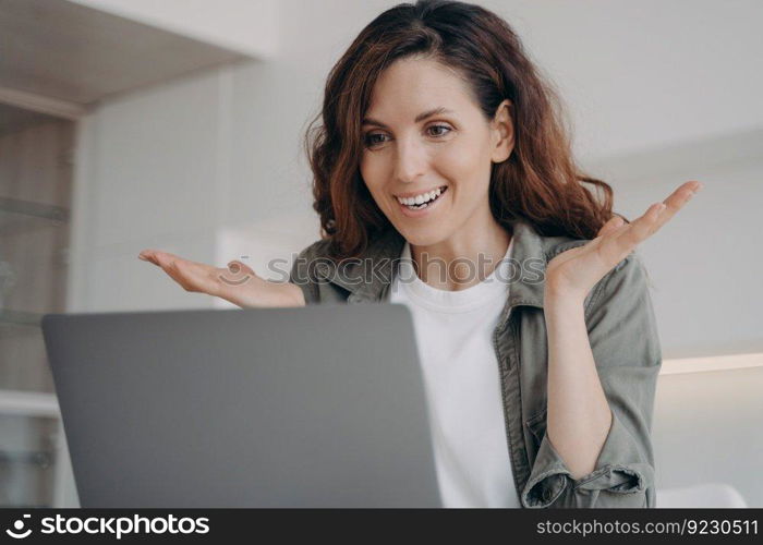 Young european woman has video call on laptop and have talk. Online meeting. Freelancer has corporate internet session. Girl staying home on quarantine. Remote work and communication.. Young woman has video call on laptop and have talk. Online meeting and remote communication.