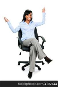 Young excited black businesswoman sitting in leather office chair