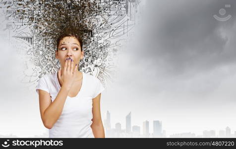 Young excited woman in casual closing mouth with palm