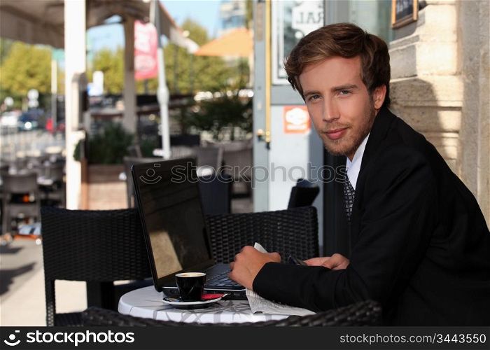 Young executive in a cafe
